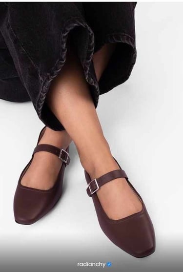 a woman's feet wearing a pair of shoes
