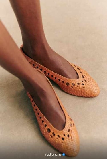 a woman's feet in a pair of shoes