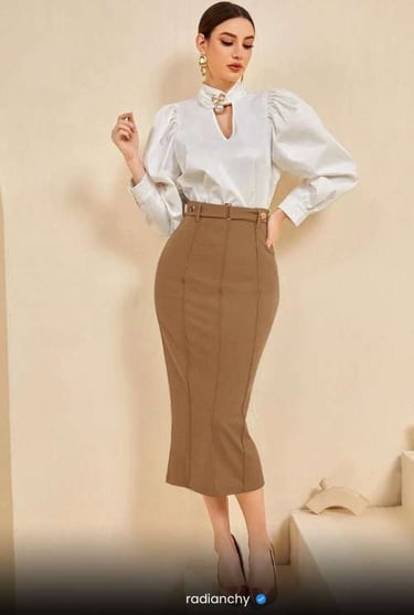 a woman in a white shirt and skirt with a white blouse