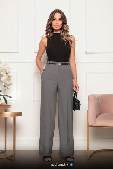 a woman in a black top and pants with a black top and a black pants