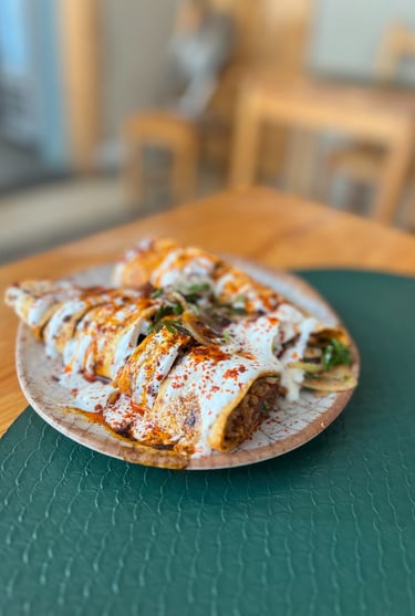 Tantuni kebab on the plate with yogurt
