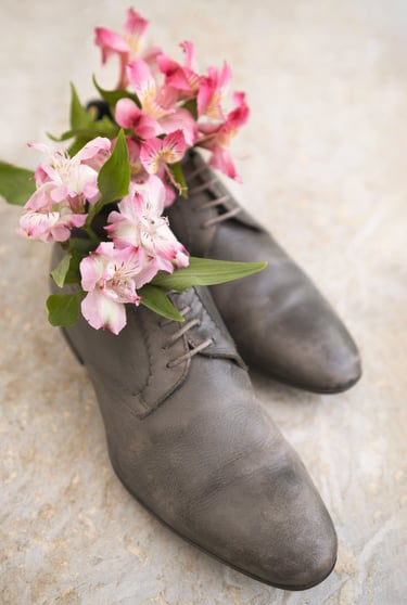 a pair of shoes with flowers on them