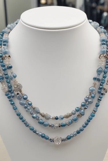 Artistic shot of mixed crystal bracelets and necklaces arranged on a soft fabric.