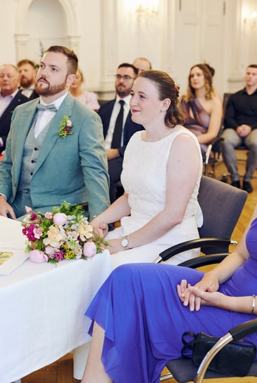 Bride sitting during a civil ceremony.