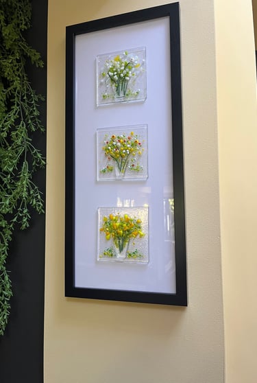 a picture of a picture of fused glass flowers