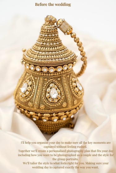 gold asian bag with clear diamonds resting on gold silk fabric