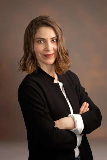 a woman in a black jacket and white shirt
