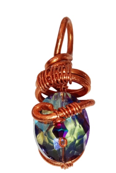 Handmade copper wire wrapped pendant featuring a faceted iridescent crystal gemstone for boho jewelry.