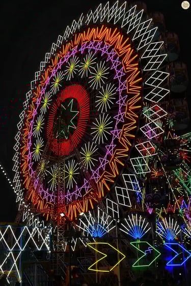 Glowing giant wheels and thrilling rides light up the night sky at Kota Dussehra Mela.