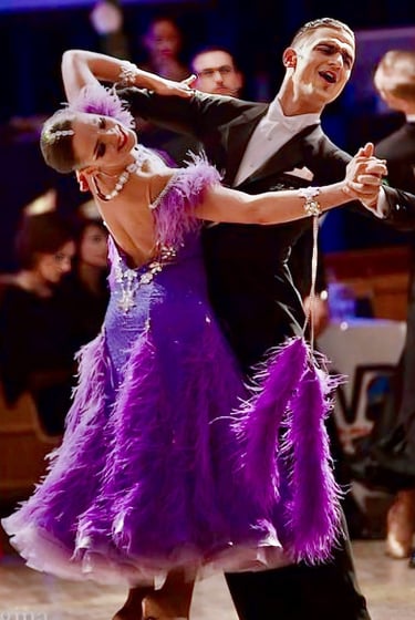 a man and woman dancing ballroom
