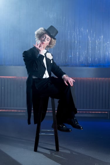 a man in a tuxedo suit and a top hat