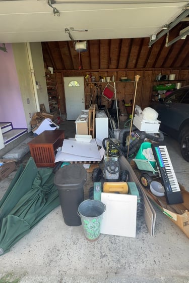 Cluttered garage before junk removal and cleanout