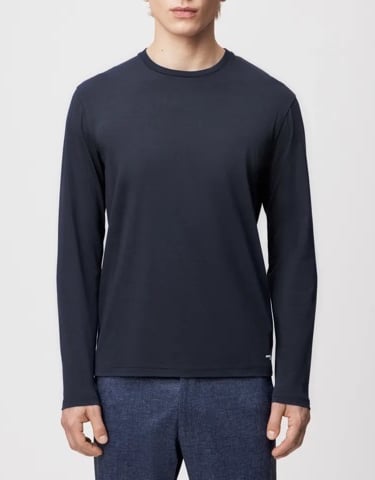 a man in a black shirt and pants with a black shirt