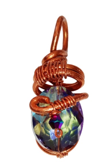 Handmade copper wire wrapped pendant featuring a faceted iridescent crystal gemstone for boho jewelry.