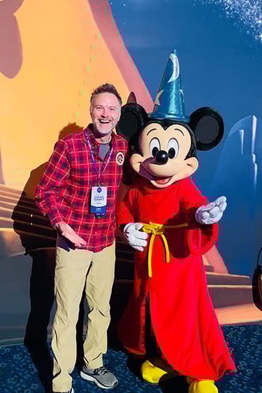 Chris Breedlove pictured with Mickey Mouse at the Disneyland® Hotel.