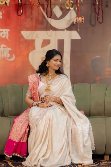 Closeup of a radiant bride's makeup being perfected by R&D Bridal Studio artist for her baby shower