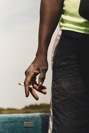 a man holding a cigarette in his hand