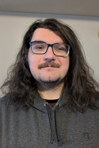 Headshot of J Brenkus