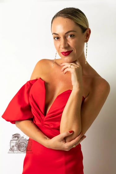 a woman in a red dress posing for a photo