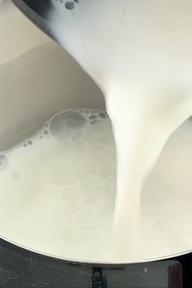 Warm the milk to a gentle simmer