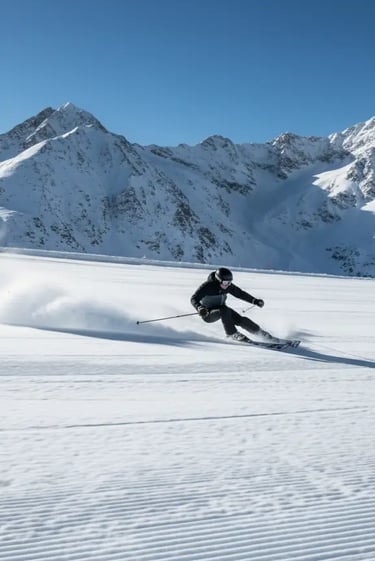 A skier carving through fresh powder on a wide, sunny alpine slope, capturing the essence of skiing 