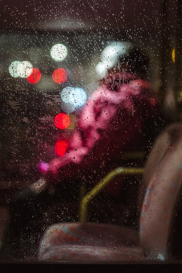 An abstract of a person seated in public transport, created by Josh K Jackson.