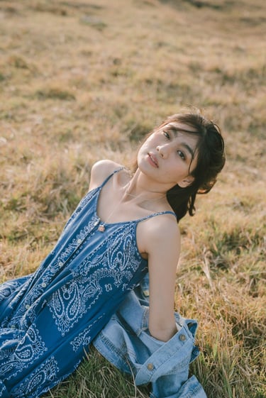 Editorial portrait in natural grass field near Pantai Nyanyi Tabanan Bali