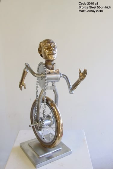 a metal sculpture of a man as a bicycle