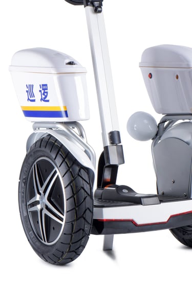 a white scooter with a white wheel and a black wheel
