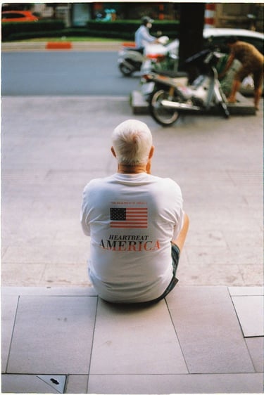 Vietnamese man sit on the pavement is Saigon China town shot on film