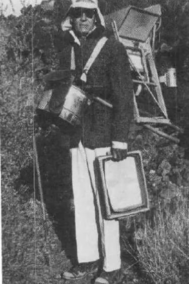 a man in a mining outfit holding mining equipment
