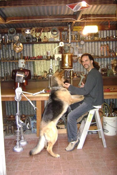 Artist Tal Avitzur in workshop with canine friend Mancha.