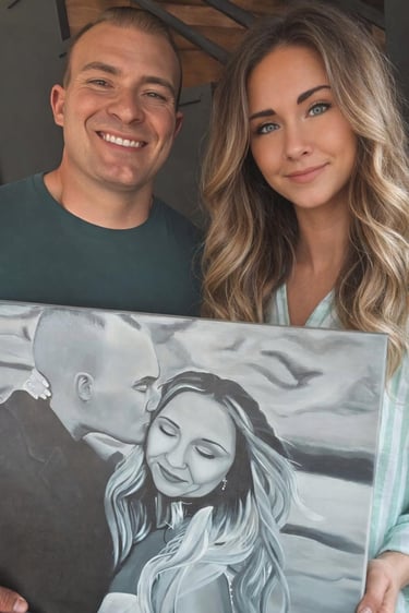 Wedding painting portrait in black and white held by its subjects, Shannon and Cole