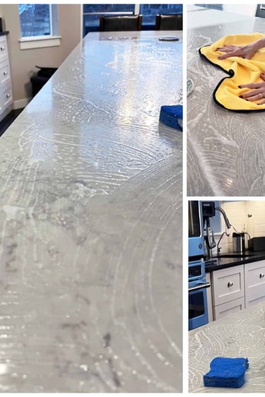 a person cleaning a counter top with a bottle of liquid