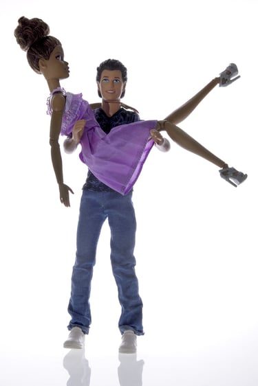 a doll with a man holding a woman