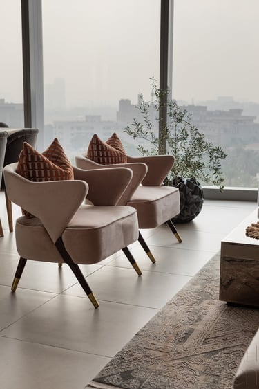 a living room with a couch and chairs, interior design
