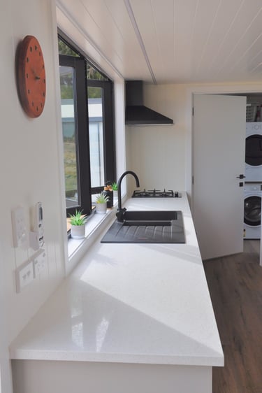 Kitchen tap, rangehood and window 