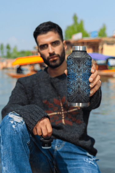 a man holding a water bottle in his hand