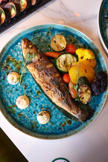 a herring fish on a plate with vegetables