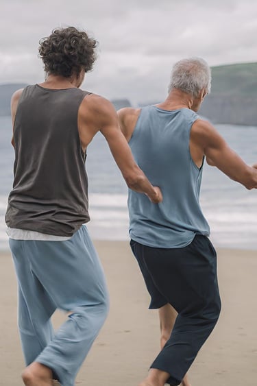 Two men dancing on the beach together