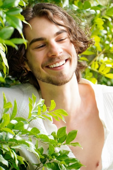 a man with a beard and a white shirt