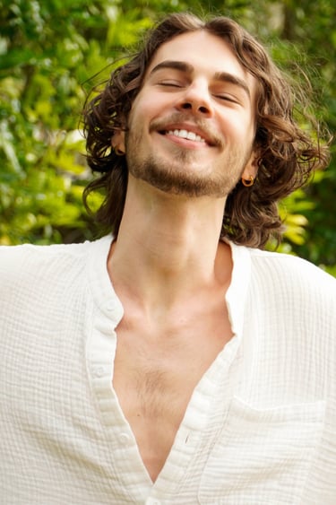 a man with a beard and a white shirt