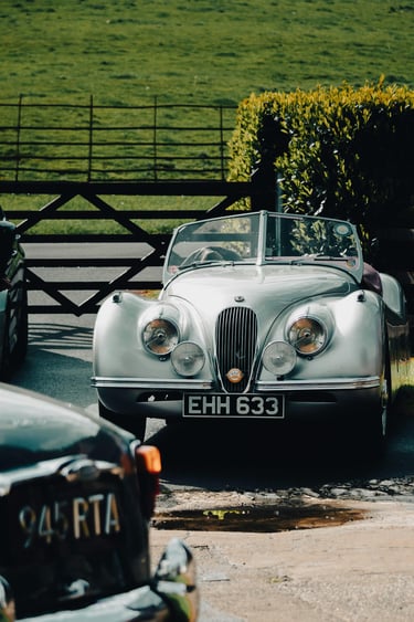 Image of British classic cars in driveway