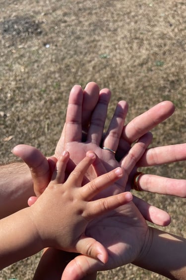 A family holding hands together