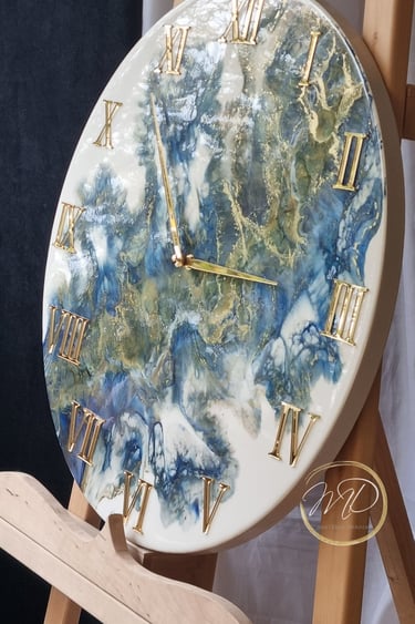 handmade clock from epoxy resin in blue and gold colours