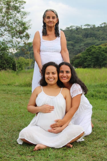 Grandmother Raquel holding the head of her Daughter and Granddaughter.