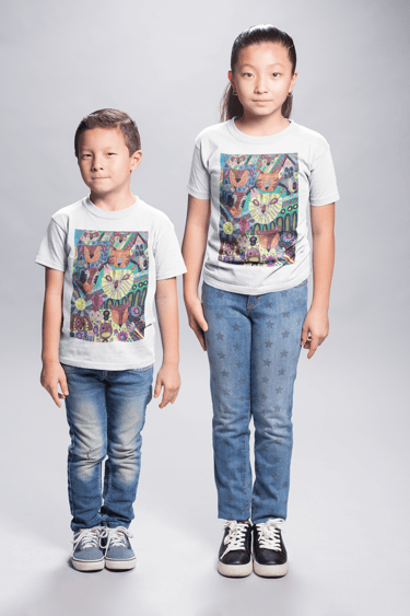 two children standing next to each other wear a white t shirt with design featured on it