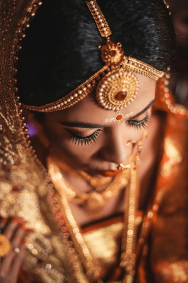 a woman in a gold and gold bridalle with a veil and a veil