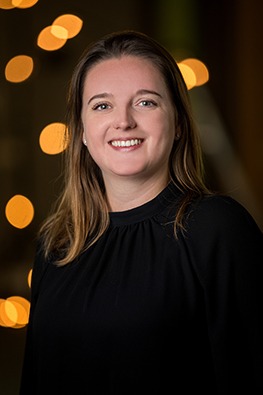 a woman in a black top and a white shirt