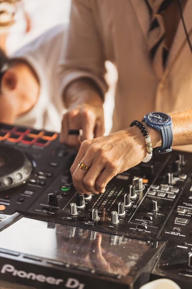 Close-up of DJ Miguel Cuartín performing a deep afro house set during the SOLÉ sunset journey.